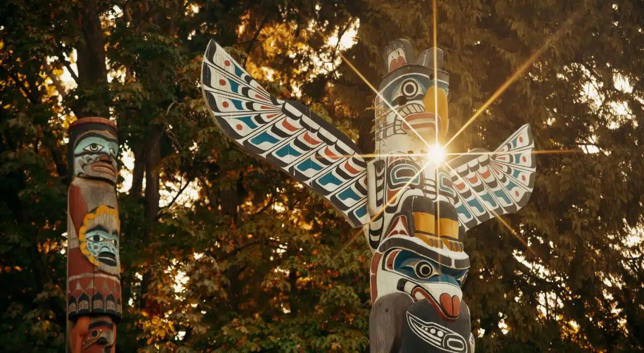 Indigenous totem poles with sun ray in Stanley Park